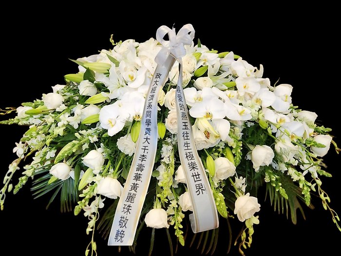 White assortment casket spray