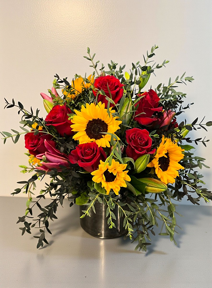 Sunflower and red rose blooming vase